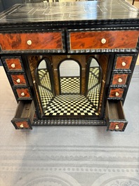 A small tortoiseshell-veneered cabinet of drawers with mirrored interior, Antwerp, 17th C.