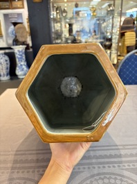 A rare Chinese hexagonal copper-red, blue and white brown-ground vase, 19th C.
