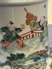 A fine Chinese famille verte 'Sanxing' rouleau vase with a gilt-bronze mount, Qing