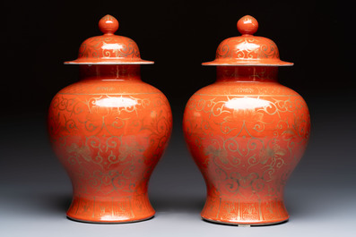 A pair of Chinese gilt-decorated coral-ground covered vases and a 'Double Happiness 囍' jardini&egrave;re, 19th C.