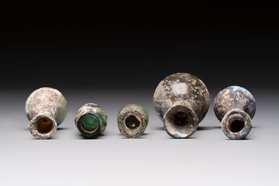 Eight Roman glass flasks, three glass bracelets and two bronze rings, 1st/4th C.