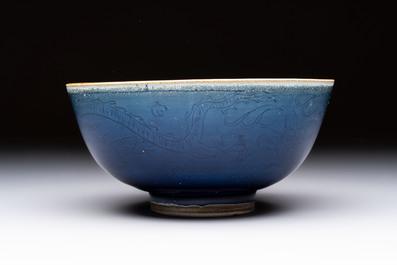 A Chinese blue-glazed 'Hatcher Cargo' bowl with incised dragons, Transitional period