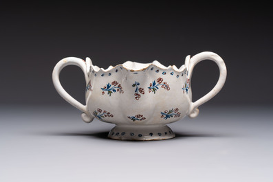 Two reticulated Brussels faience 'A la Haie Fleurie' baskets and a sauce boat, 18th C.
