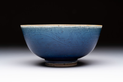 A Chinese blue-glazed 'Hatcher Cargo' bowl with incised dragons, Transitional period