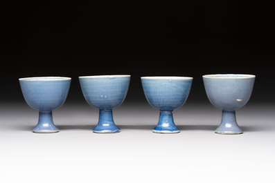 Four Chinese blue-glazed 'Hatcher Cargo' stem cups, Transitional period