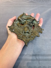 A Tibetan or Nepalese bronze seated Tara holding a vajra, 12/13th C.