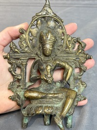 A Tibetan or Nepalese bronze seated Tara holding a vajra, 12/13th C.