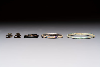 Eight Roman glass flasks, three glass bracelets and two bronze rings, 1st/4th C.