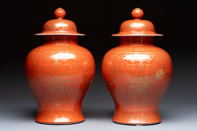A pair of Chinese gilt-decorated coral-ground covered vases and a 'Double Happiness 囍' jardini&egrave;re, 19th C.