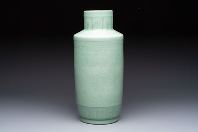 A Chinese celadon-glazed rouleau vase with incised floral design, 18th C.