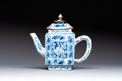 A rare blue and white Dutch Delft relief-moulded teapot and cover, late 17th C.