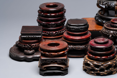A collection of 38 Chinese wooden stands and a box, 19/20th C.