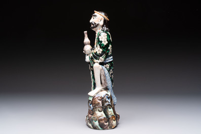 A pair of Chinese famille verte covered jars, a Tieguai Li figure, a blue and white teapot and a biscuit saucer, Kangxi and Qing Yu Tang mark, 19th C.