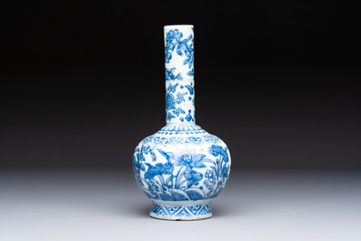 A Chinese blue and white bottle vase with floral design, hare mark, Wanli