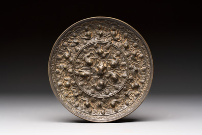 Two Chinese bronze mirrors, one inscribed &lsquo;Fu Shan Shou Hai 福山壽海' and the other with sea animals and grape design, Qing