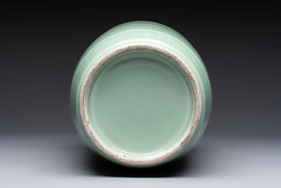 A Chinese celadon-glazed rouleau vase with incised floral design, 18th C.