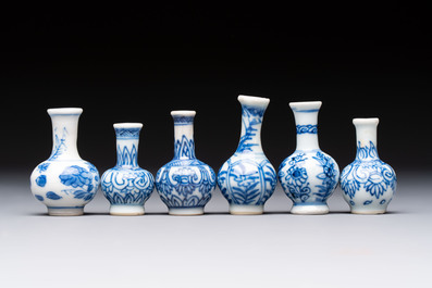 A group of 12 Chinese blue and white miniature vases and a small bottle vase, Kangxi