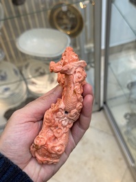 A Chinese carved red coral 'dragon' group, 19/20th C.