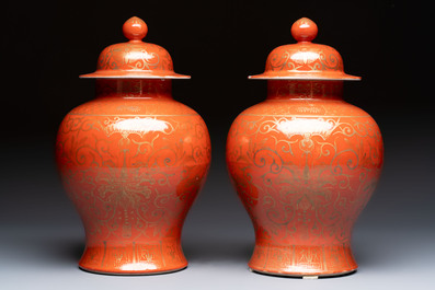 A pair of Chinese gilt-decorated coral-ground covered vases and a 'Double Happiness 囍' jardini&egrave;re, 19th C.