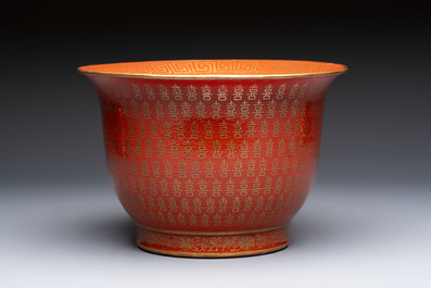 A pair of Chinese gilt-decorated coral-ground covered vases and a 'Double Happiness 囍' jardini&egrave;re, 19th C.