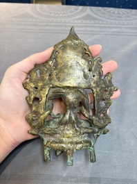 A Tibetan or Nepalese bronze seated Tara holding a vajra, 12/13th C.