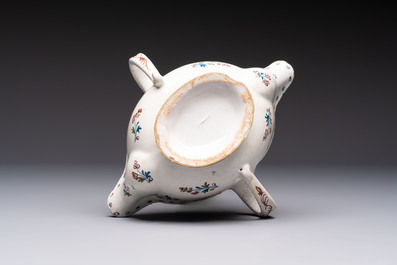 Two reticulated Brussels faience 'A la Haie Fleurie' baskets and a sauce boat, 18th C.