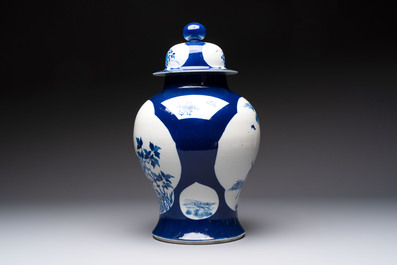 A Chinese blue and white powder-blue-ground 'He Xiangu 何仙姑' vase and cover, 19th C.