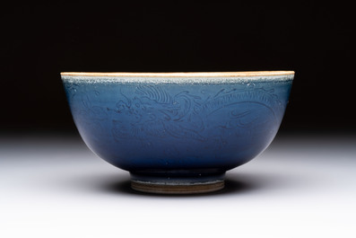 A Chinese blue-glazed 'Hatcher Cargo' bowl with incised dragons, Transitional period