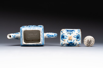 A rare blue and white Dutch Delft relief-moulded teapot and cover, late 17th C.