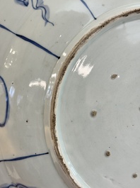 A massive Japanese Arita blue and white 'fisherman' dish, Edo, 17th C.