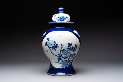 A Chinese blue and white powder-blue-ground 'He Xiangu 何仙姑' vase and cover, 19th C.
