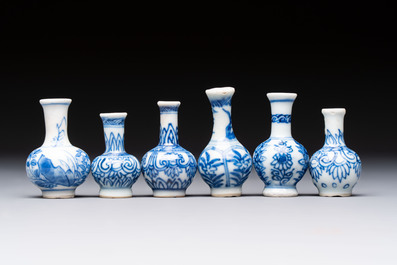 A group of 12 Chinese blue and white miniature vases and a small bottle vase, Kangxi
