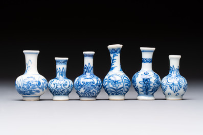 A group of 12 Chinese blue and white miniature vases and a small bottle vase, Kangxi