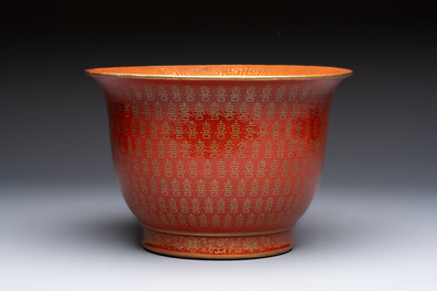 A pair of Chinese gilt-decorated coral-ground covered vases and a 'Double Happiness 囍' jardini&egrave;re, 19th C.