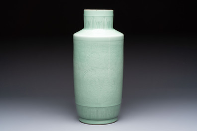 A Chinese celadon-glazed rouleau vase with incised floral design, 18th C.