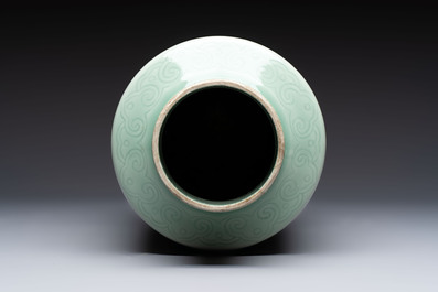 A Chinese celadon-glazed rouleau vase with incised floral design, 18th C.