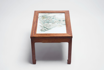 A Chinese qianjiang cai &lsquo;Mountainous Landscape&rsquo; plaque-inset hongmu low table , 19/20th C.
