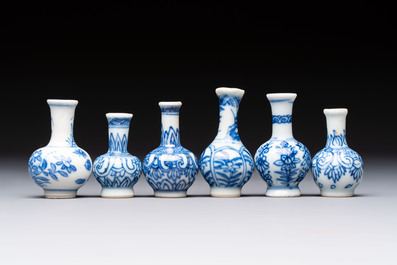 A group of 12 Chinese blue and white miniature vases and a small bottle vase, Kangxi