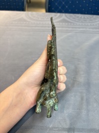 A Tibetan or Nepalese bronze seated Tara holding a vajra, 12/13th C.