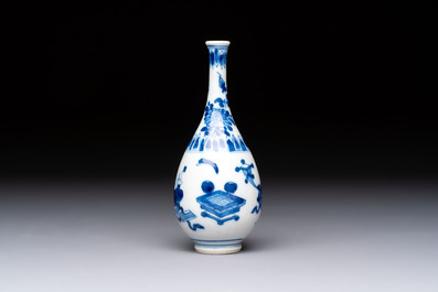 A group of 12 Chinese blue and white miniature vases and a small bottle vase, Kangxi