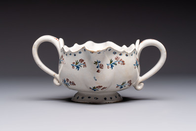 Two reticulated Brussels faience 'A la Haie Fleurie' baskets and a sauce boat, 18th C.