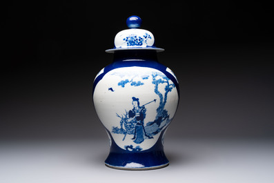 A Chinese blue and white powder-blue-ground 'He Xiangu 何仙姑' vase and cover, 19th C.