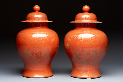 A pair of Chinese gilt-decorated coral-ground covered vases and a 'Double Happiness 囍' jardini&egrave;re, 19th C.