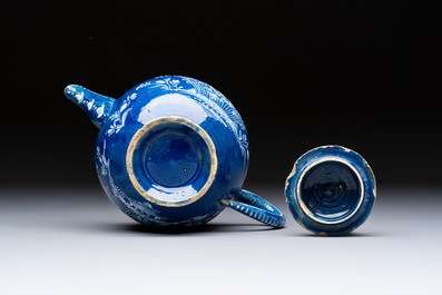 A Nevers white-decorated blue-ground faience teapot and cover, France, 18th C.