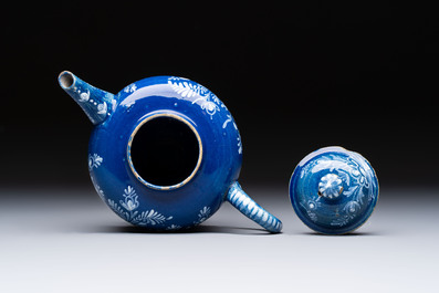 A Nevers white-decorated blue-ground faience teapot and cover, France, 18th C.