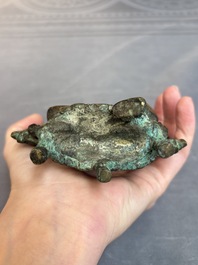 A Tibetan or Nepalese bronze seated Tara holding a vajra, 12/13th C.