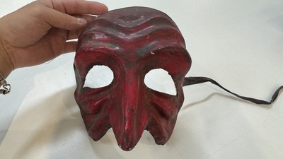 An Italian masked 'petrified' head on giltwood base, mixed media, 19/20th C.