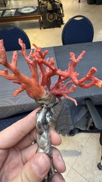A red coral mounted silver figure, possibly Germany, 19th C.