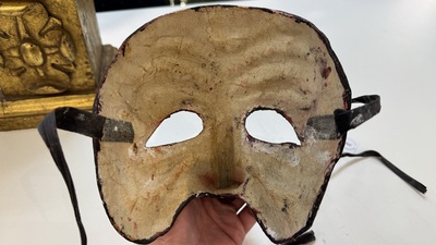 An Italian masked 'petrified' head on giltwood base, mixed media, 19/20th C.