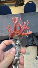 A red coral mounted silver figure, possibly Germany, 19th C.